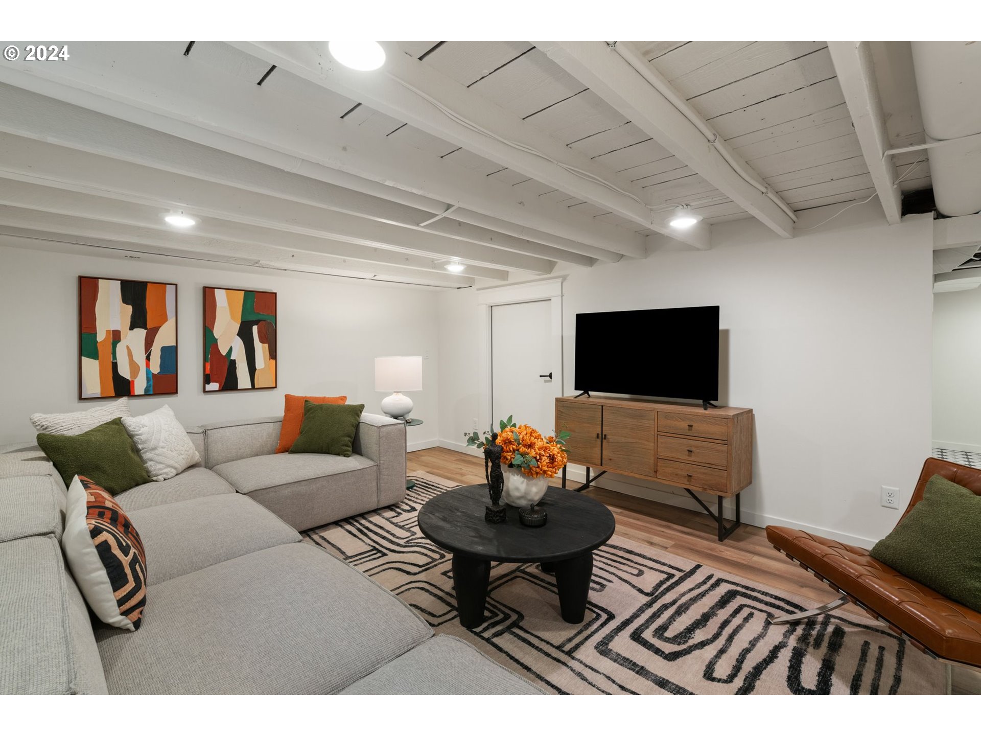 2548 Southwest St Helens Court Portland, OR 97201 - Photo 32 of 42 a living room with furniture and a flat screen tv