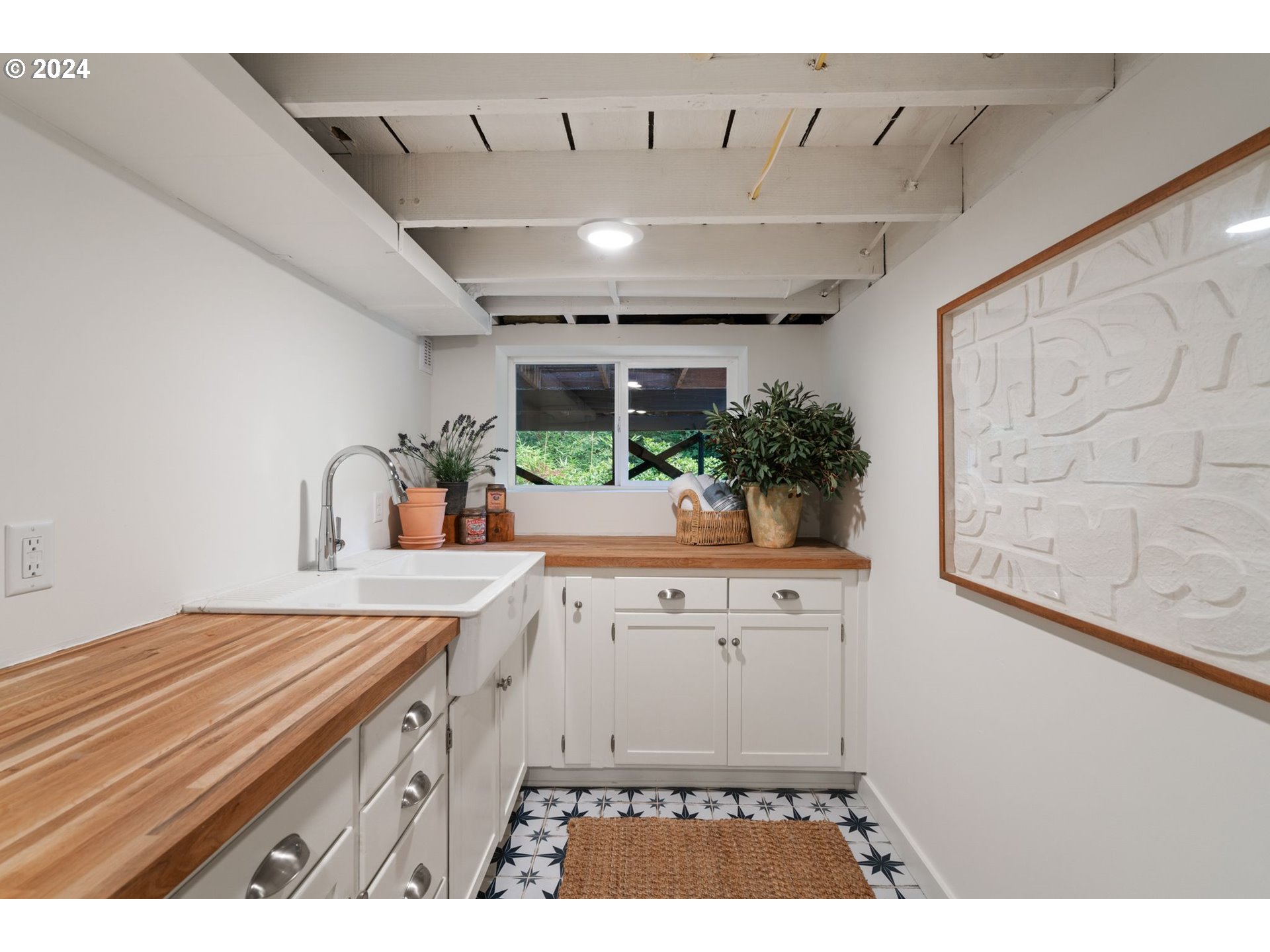 2548 Southwest St Helens Court Portland, OR 97201 - Photo 34 of 42 a kitchen with a sink and cabinets