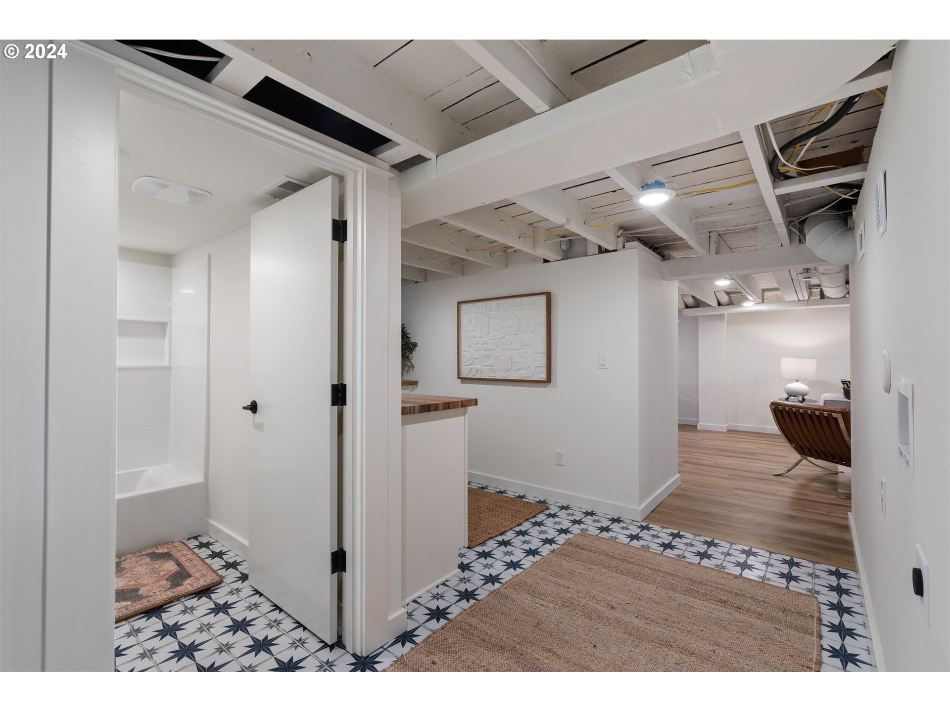 2548 Southwest St Helens Court Portland, OR 97201 - Photo 36 of 42 a view of a hallway with wooden floor