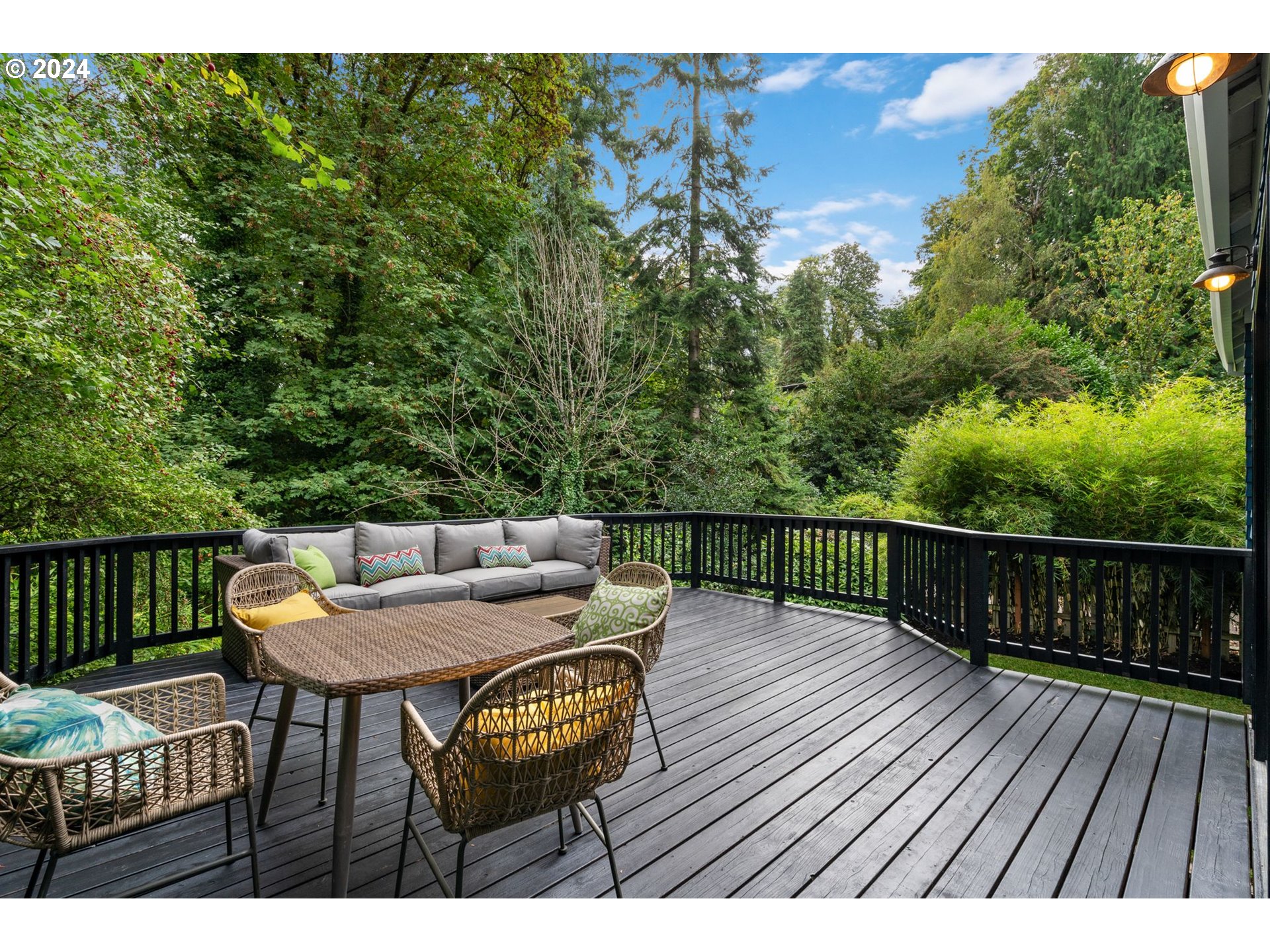 2548 Southwest St Helens Court Portland, OR 97201 - Photo 38 of 42 a balcony with wooden floor table and chairs