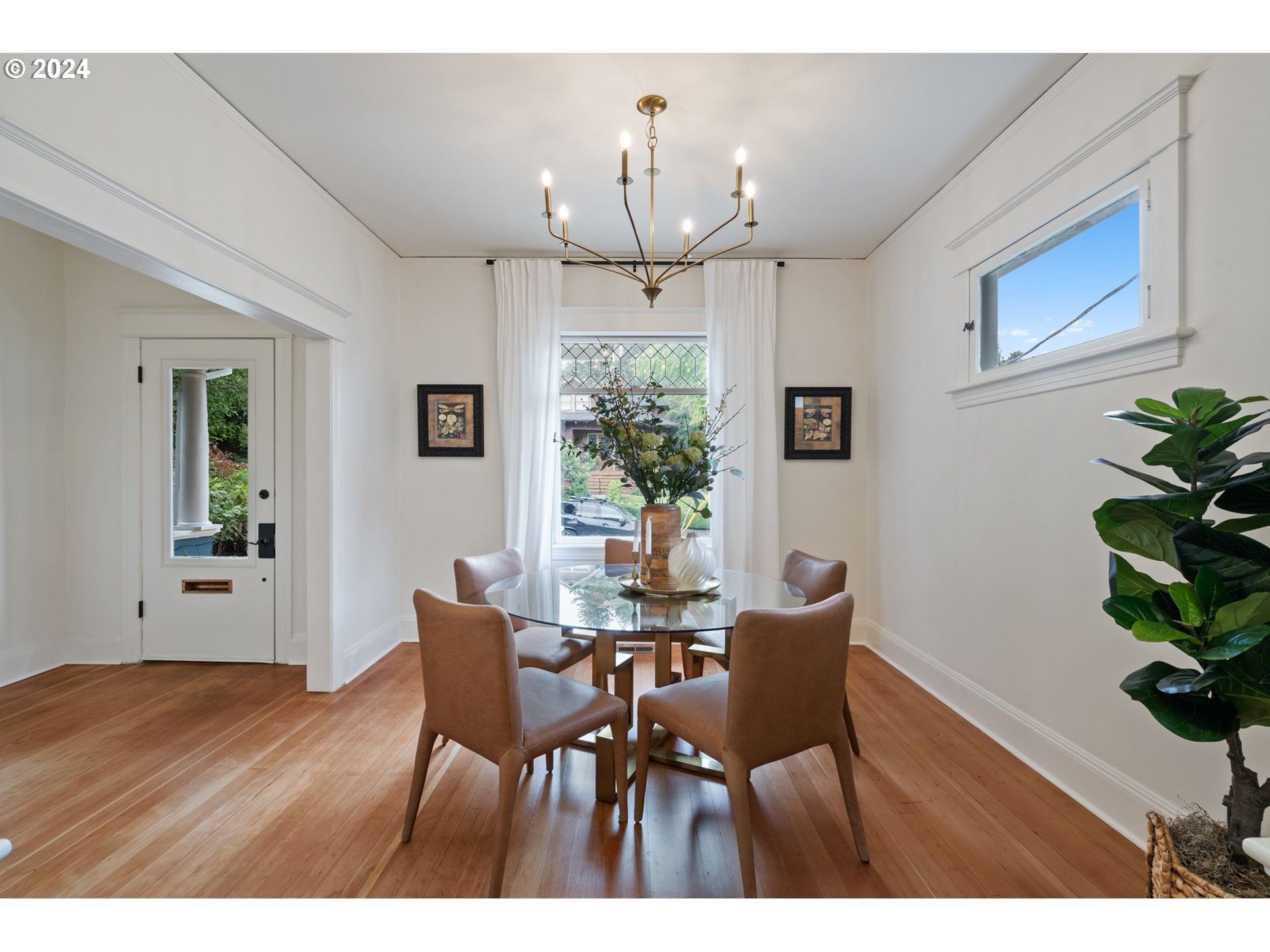 2548 Southwest St Helens Court Portland, OR 97201 - Photo 10 of 42 a view of a dining room with furniture and wooden floor