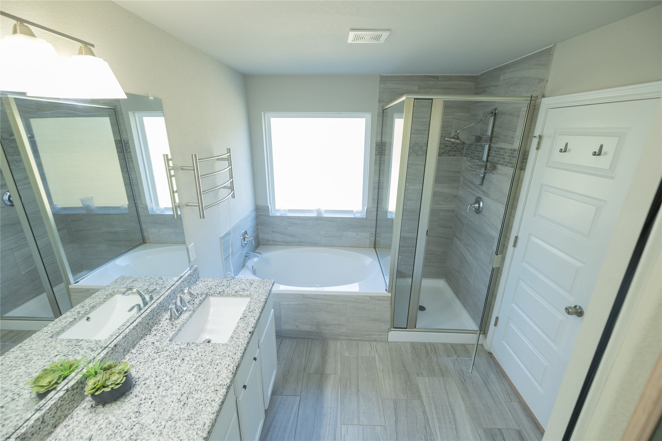 827 Savannah Cove Elgin, TX 78621 - Photo 15 of 31 Primary Full bathroom featuring a garden soaking tub, double vanity, and shower