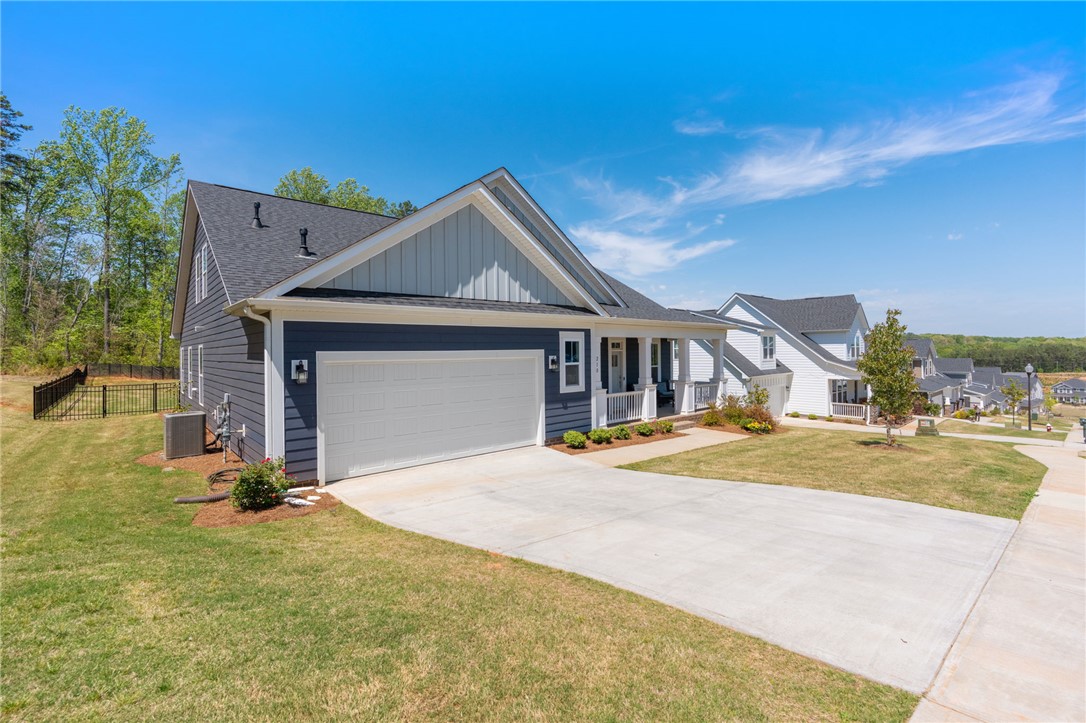 210 Maverick Trail Central, SC 29630 - Photo 2 of 41 This charming home offers a spacious garage and inviting porch.