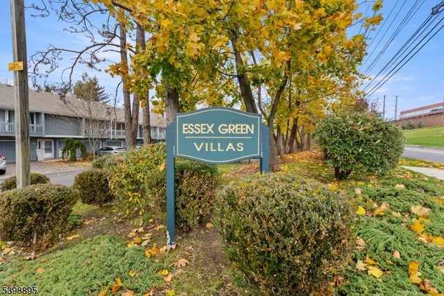 a sign broad in front of flowers