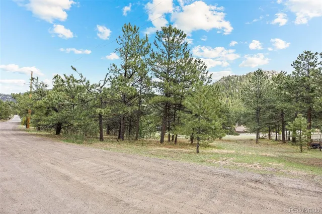 a view of a town with mountains in the background