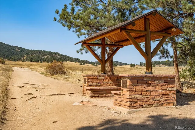 a view of a swimming pool and a yard