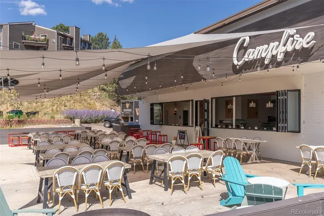 a view of a chairs and table in patio