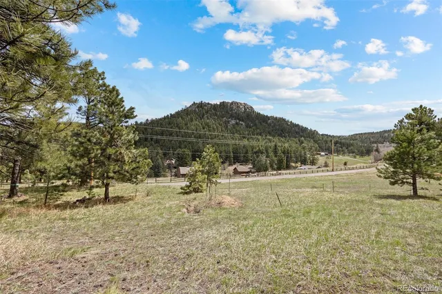 a view of a yard with an outdoor space and seating area
