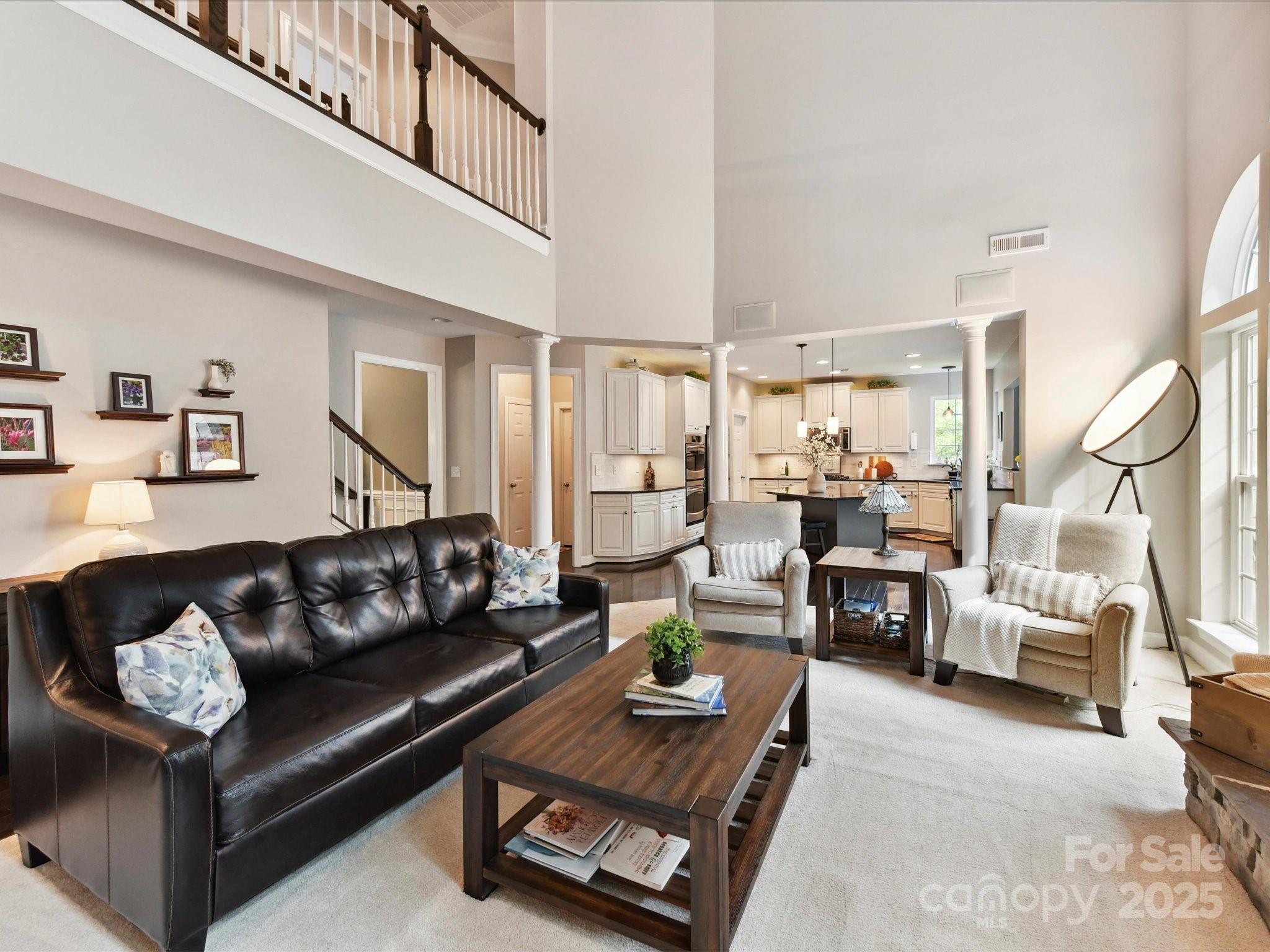 105 Beech Bluff Drive Mount Holly, NC 28120 - Photo 11 of 48 a living room with furniture or couch and a dining table