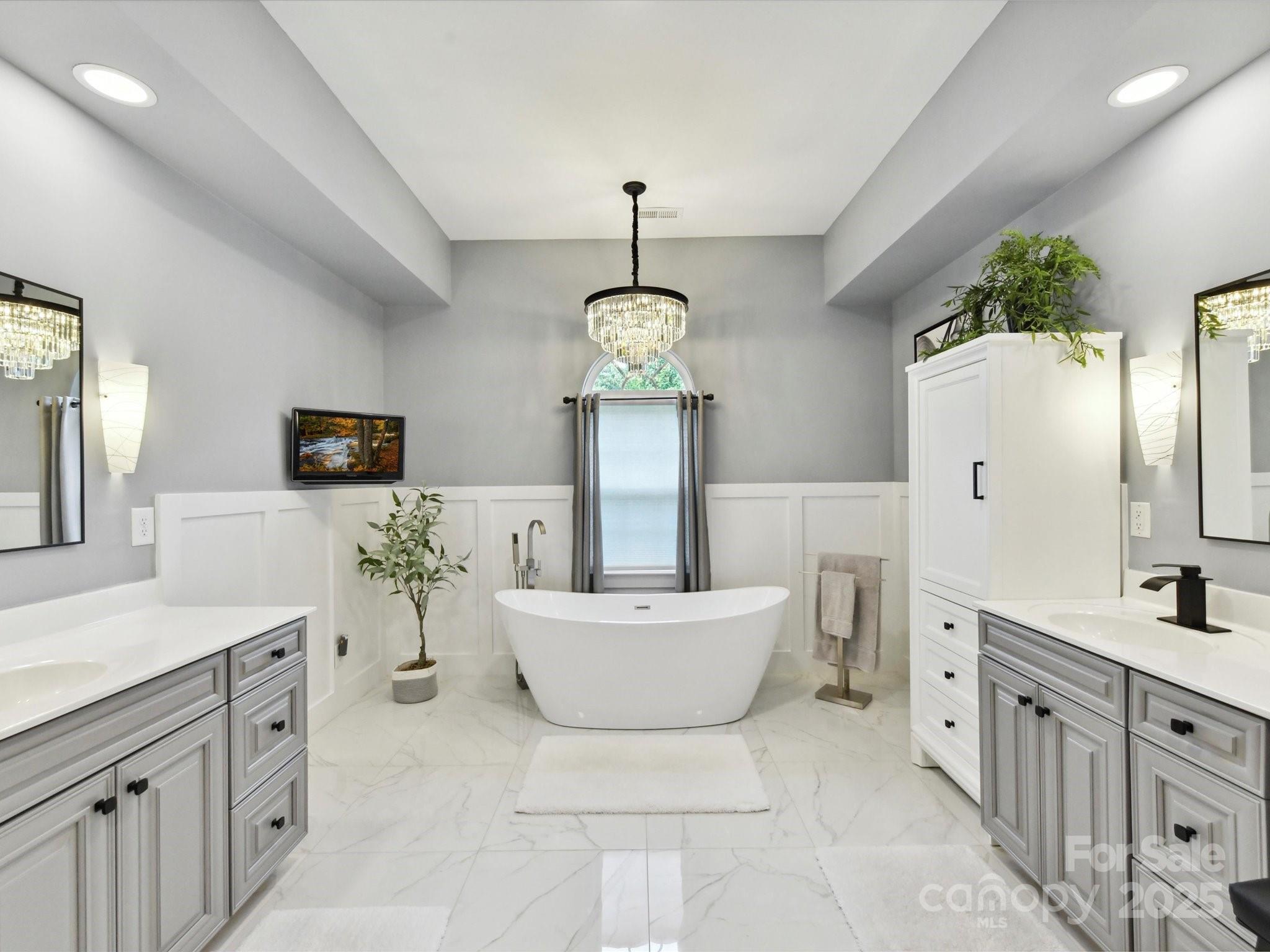 105 Beech Bluff Drive Mount Holly, NC 28120 - Photo 14 of 48 a spacious bathroom with a double vanity sink mirror and bathtub