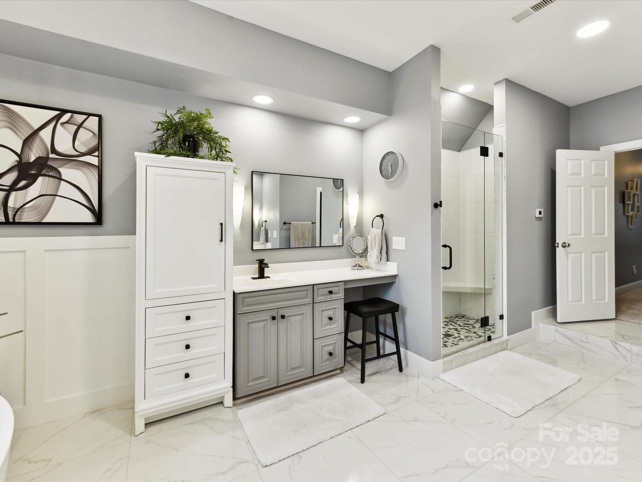 105 Beech Bluff Drive Mount Holly, NC 28120 - Photo 15 of 48 a spacious bathroom with a shower sink and mirror