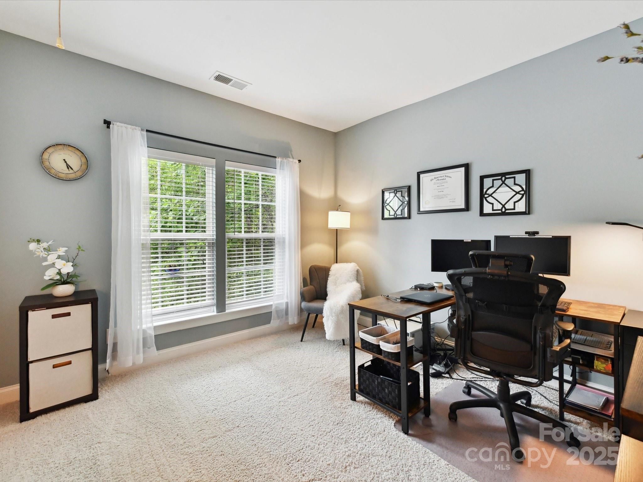 105 Beech Bluff Drive Mount Holly, NC 28120 - Photo 19 of 48 a view of a workspace with furniture and a window