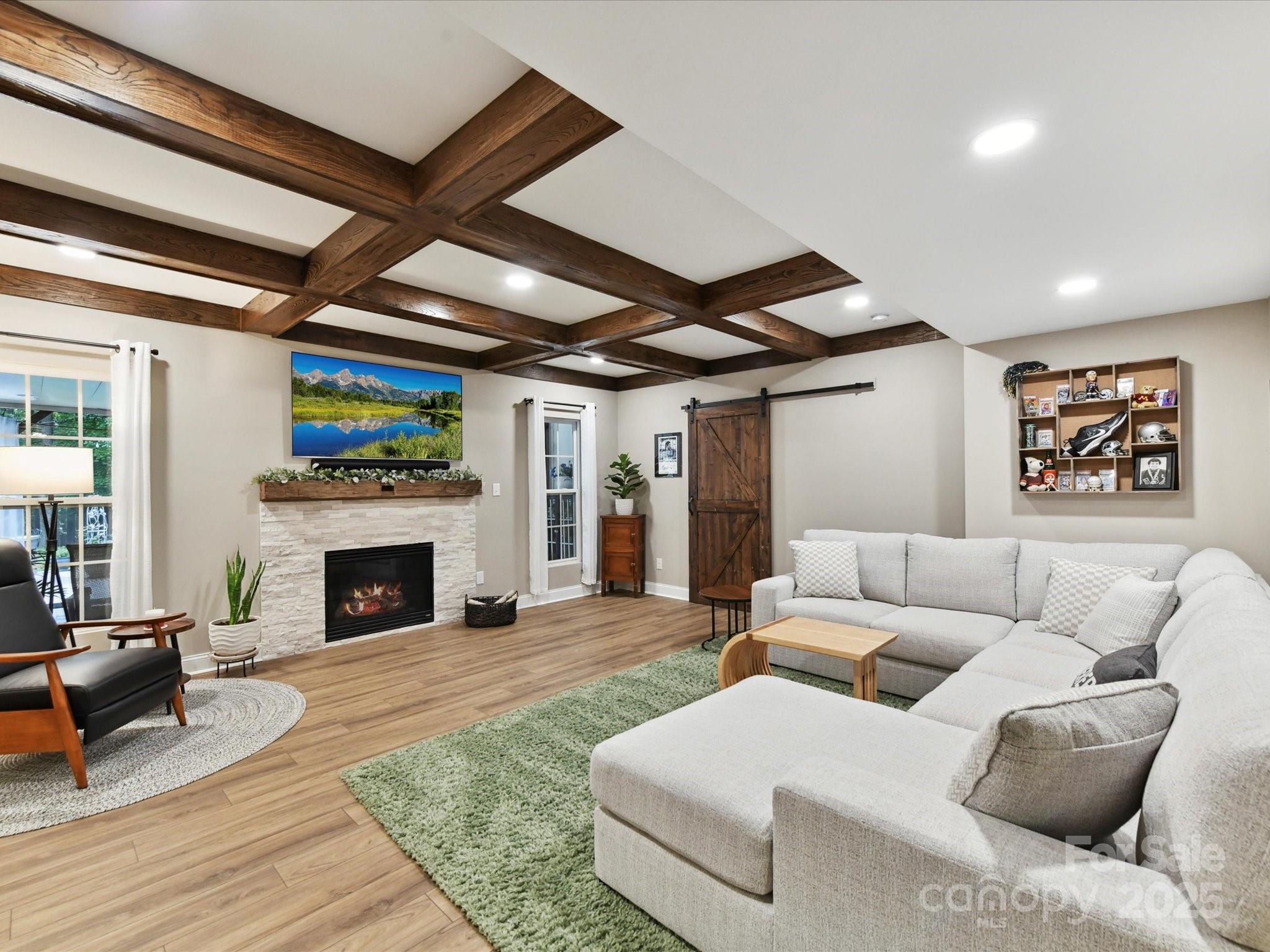 105 Beech Bluff Drive Mount Holly, NC 28120 - Photo 21 of 48 a living room with furniture and a fireplace