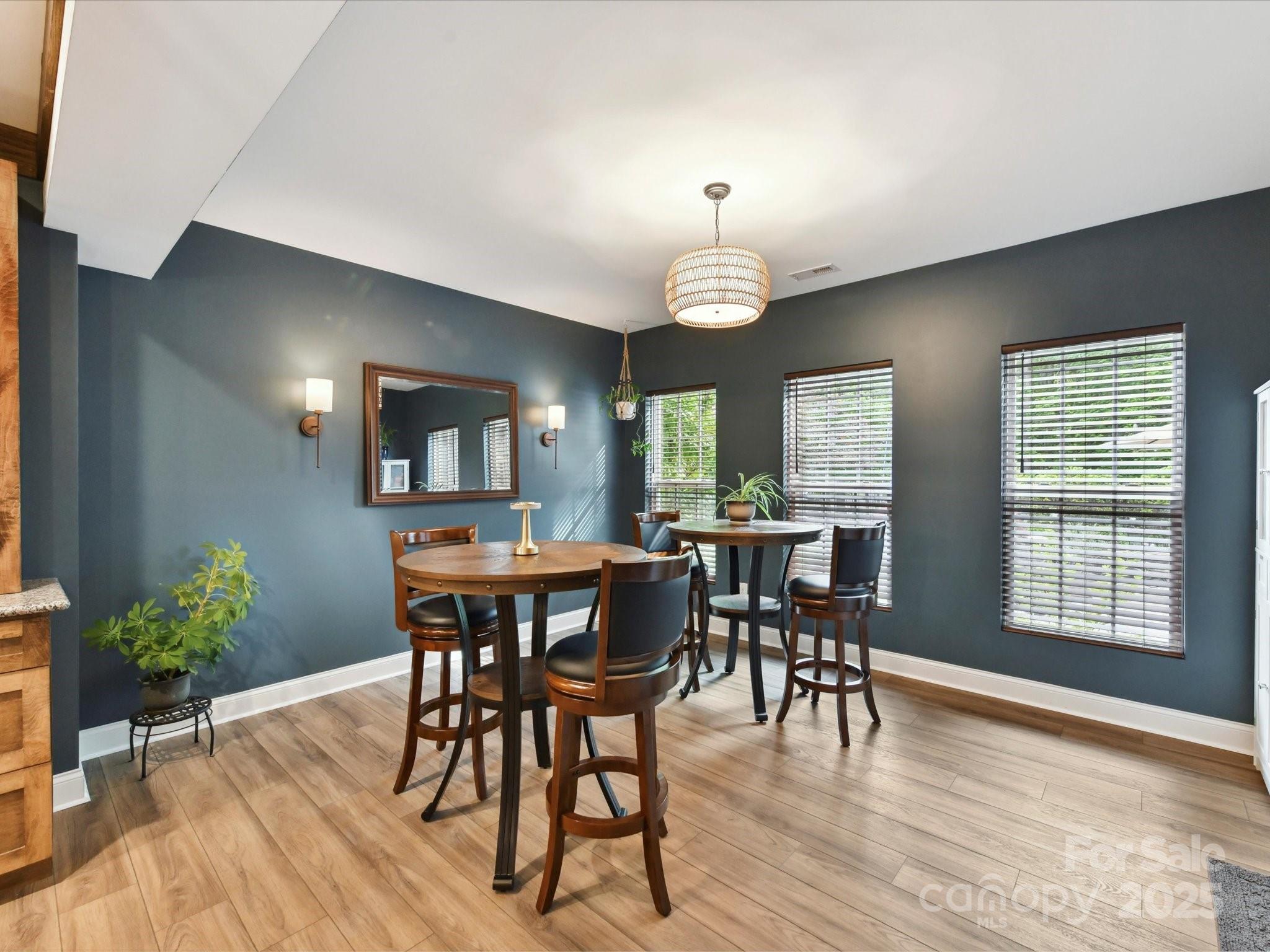 105 Beech Bluff Drive Mount Holly, NC 28120 - Photo 24 of 48 a view of a dining room with furniture window and wooden floor