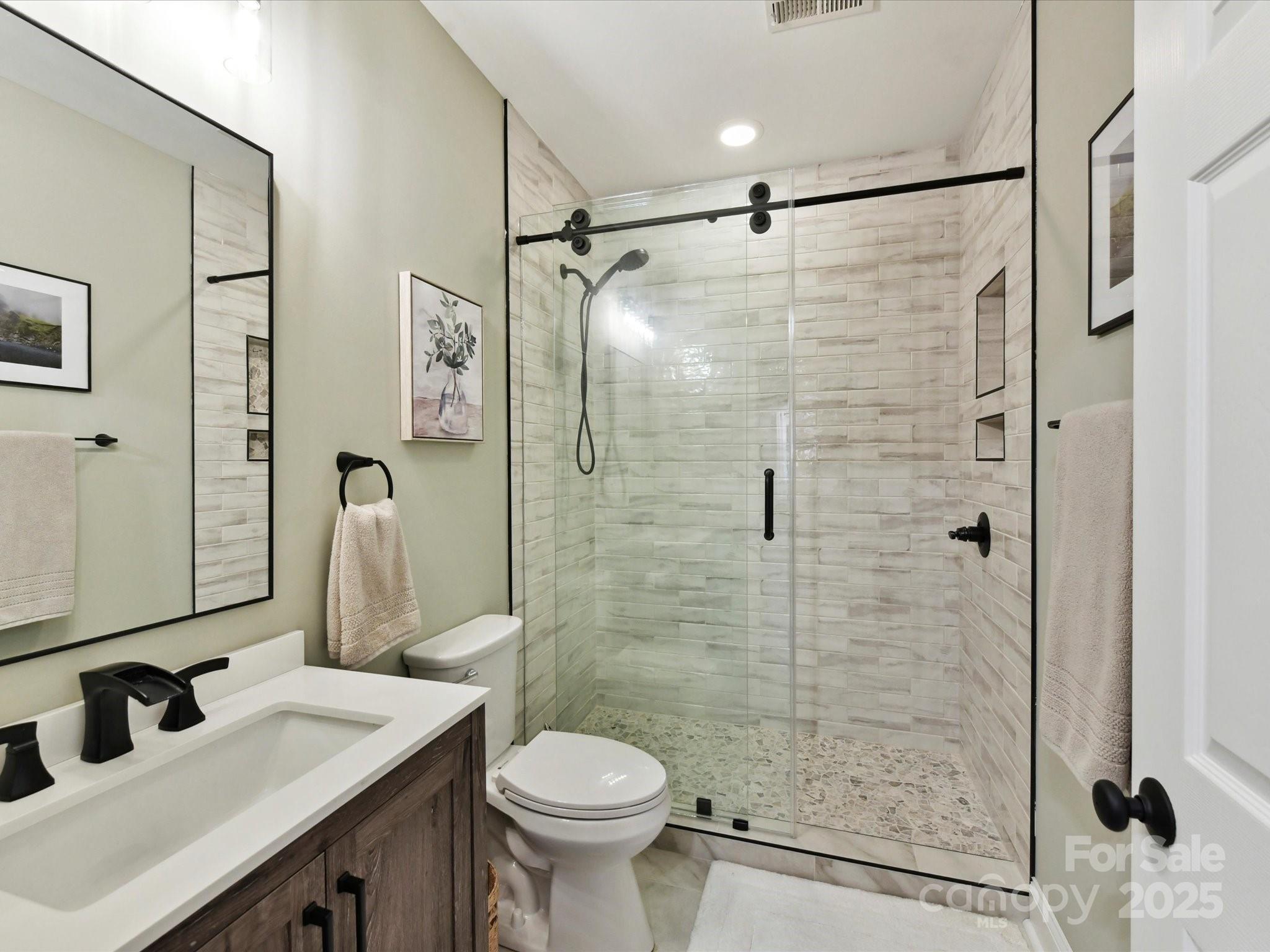 105 Beech Bluff Drive Mount Holly, NC 28120 - Photo 26 of 48 a bathroom with a sink and a mirror