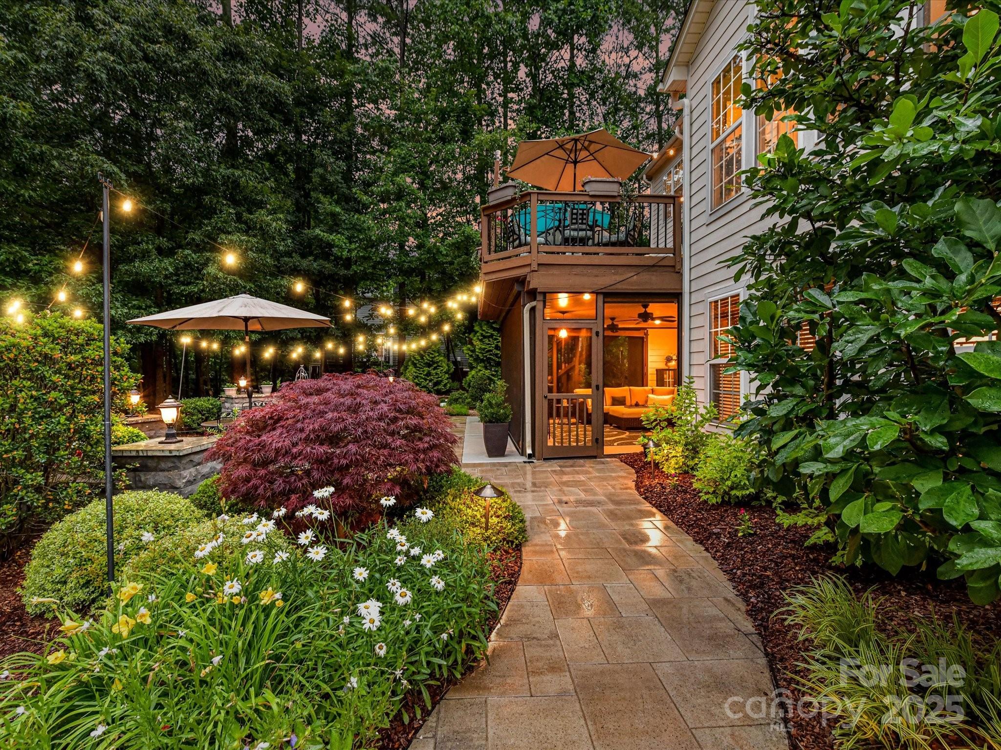 105 Beech Bluff Drive Mount Holly, NC 28120 - Photo 29 of 48 a front view of a house with a yard and fountain