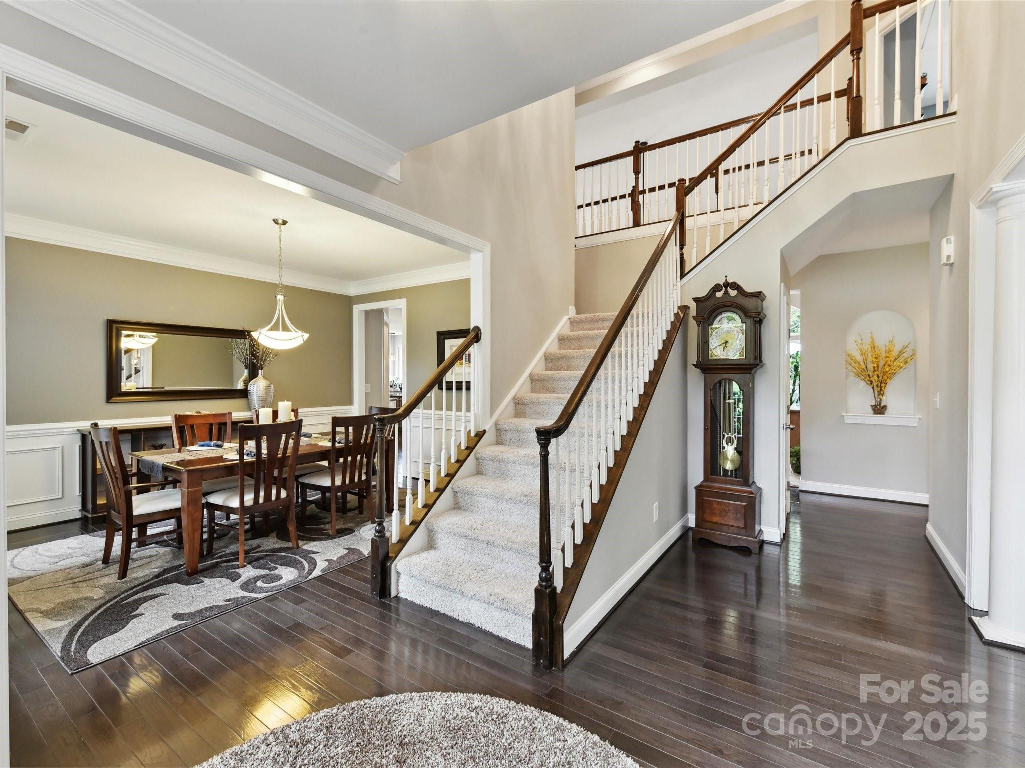 105 Beech Bluff Drive Mount Holly, NC 28120 - Photo 3 of 48 a view of dining room with furniture wooden floor and a rug