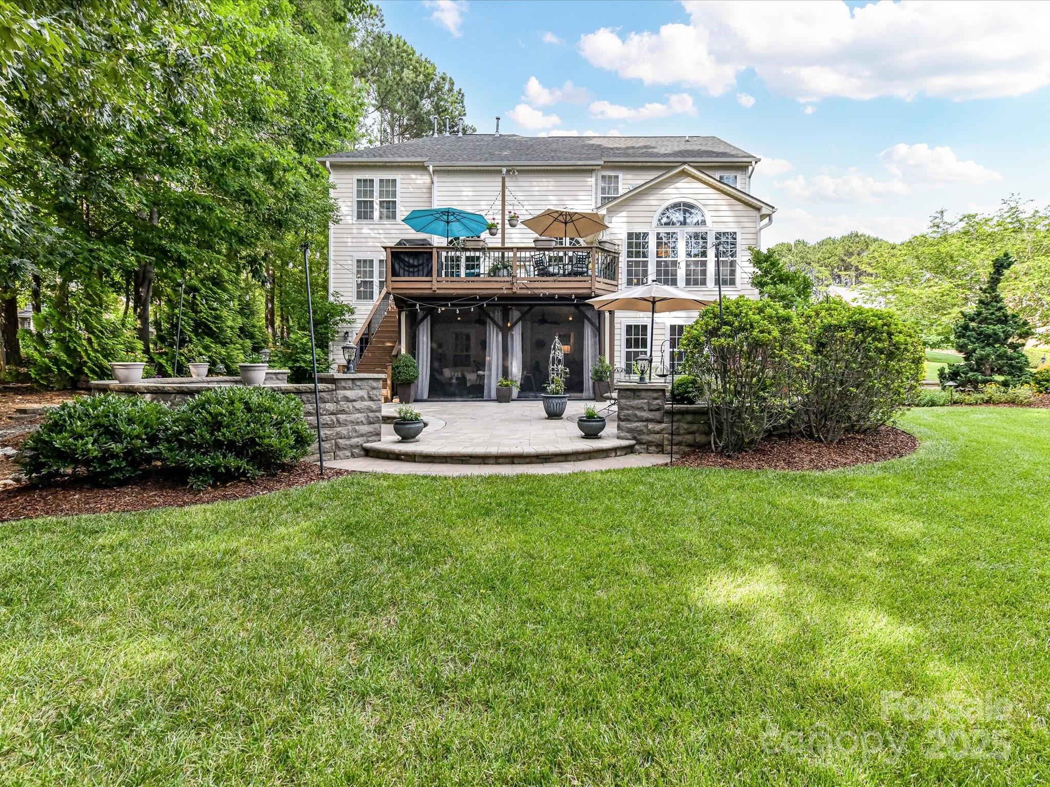 105 Beech Bluff Drive Mount Holly, NC 28120 - Photo 37 of 48 a front view of a house with garden and trees