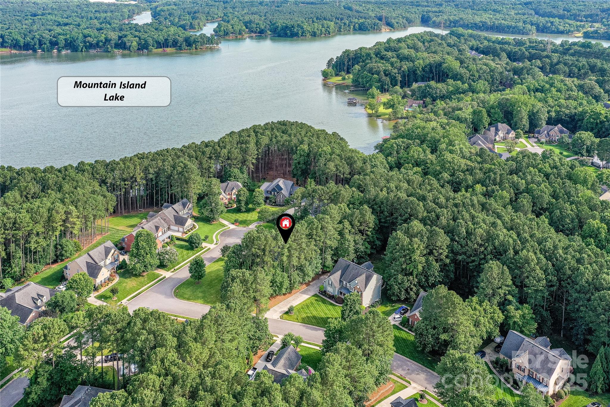 105 Beech Bluff Drive Mount Holly, NC 28120 - Photo 43 of 48 an aerial view of a house with a yard and lake view