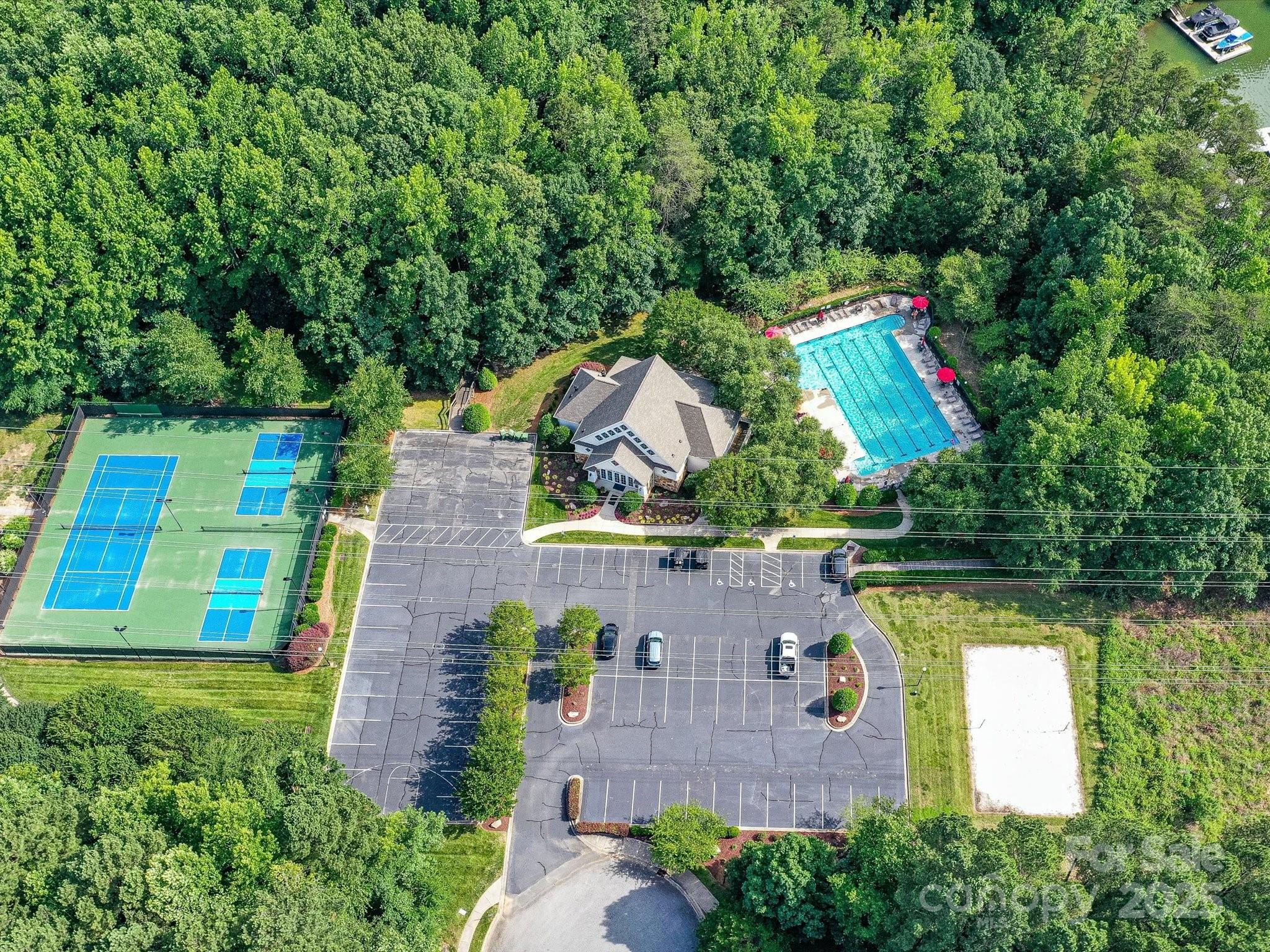 105 Beech Bluff Drive Mount Holly, NC 28120 - Photo 46 of 48 an aerial view of a house with a yard and lake view