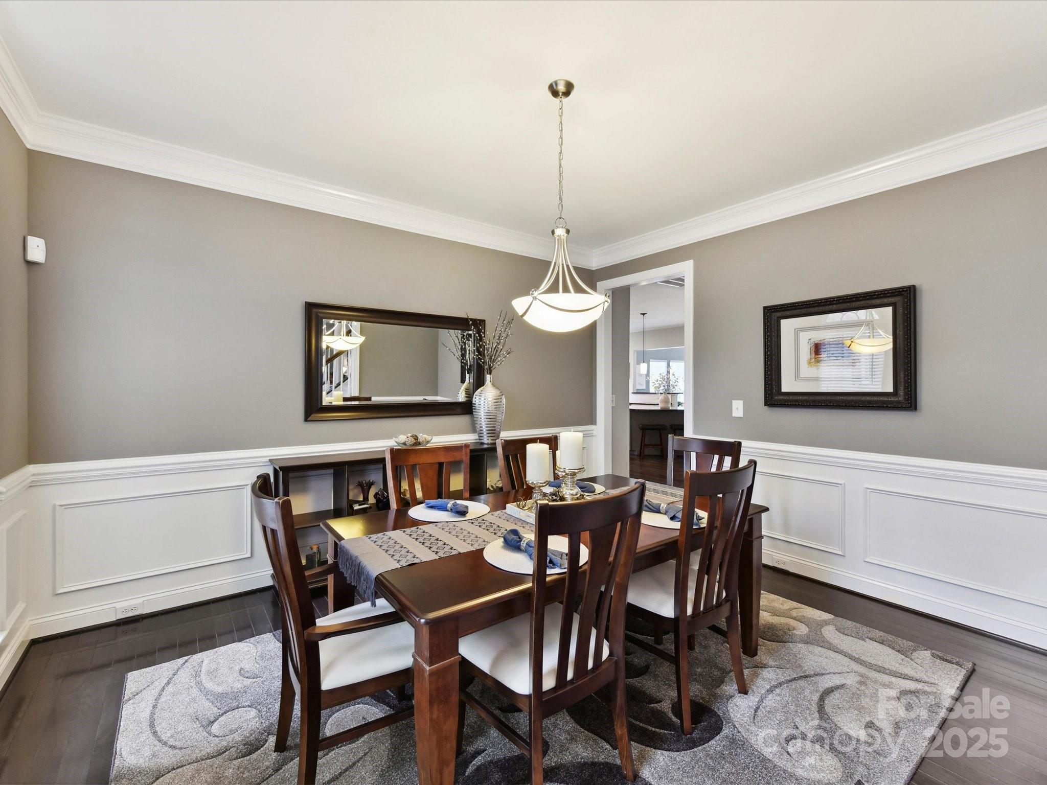 105 Beech Bluff Drive Mount Holly, NC 28120 - Photo 5 of 48 a view of a dining room with furniture and a chandelier
