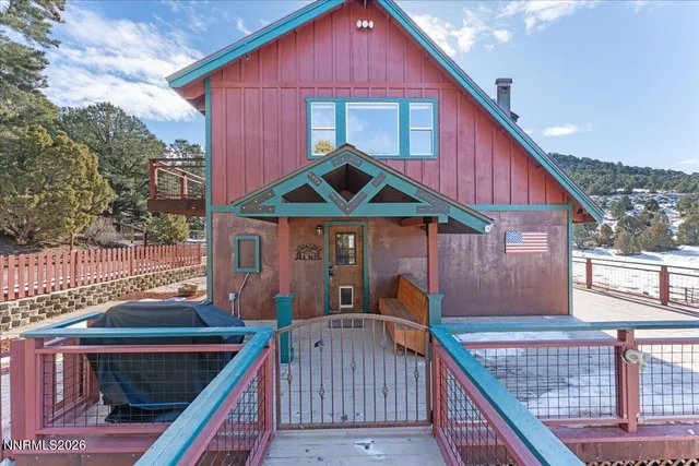 a front view of house with yard outdoor seating and barbeque oven