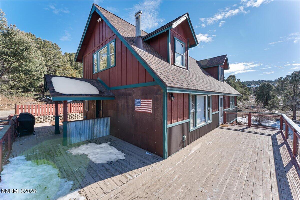 21381 Crestview Road Reno, NV 89521 - Photo 12 of 30 a view of a house with a yard and deck