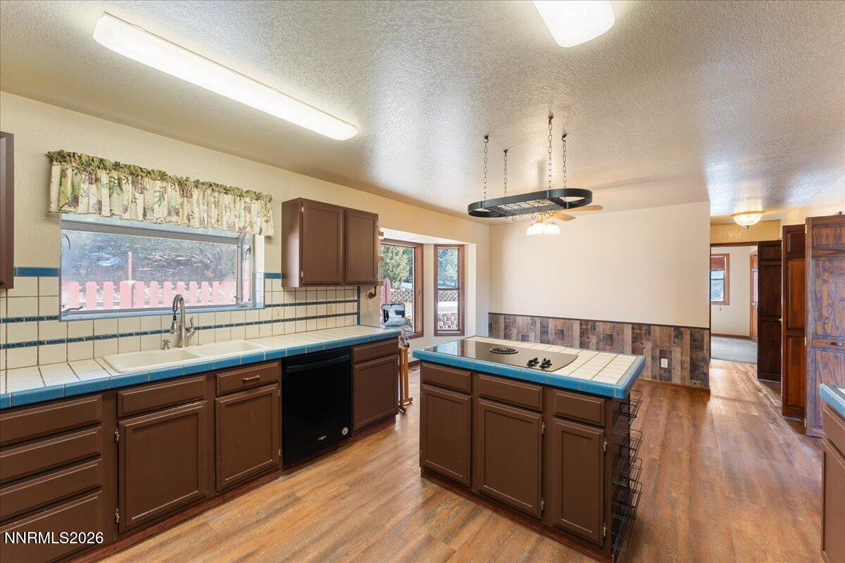 21381 Crestview Road Reno, NV 89521 - Photo 17 of 30 a kitchen with a sink stove and cabinets