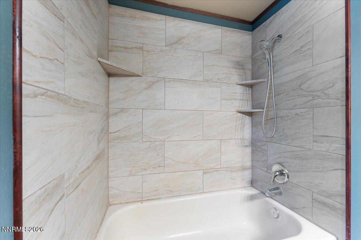21381 Crestview Road Reno, NV 89521 - Photo 27 of 30 a bathroom with a bathtub