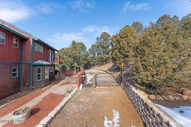 a view of a patio with wooden fence