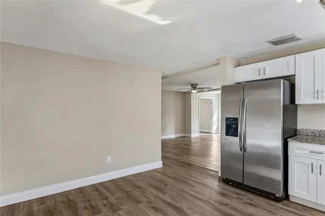 a front view of house with a garden