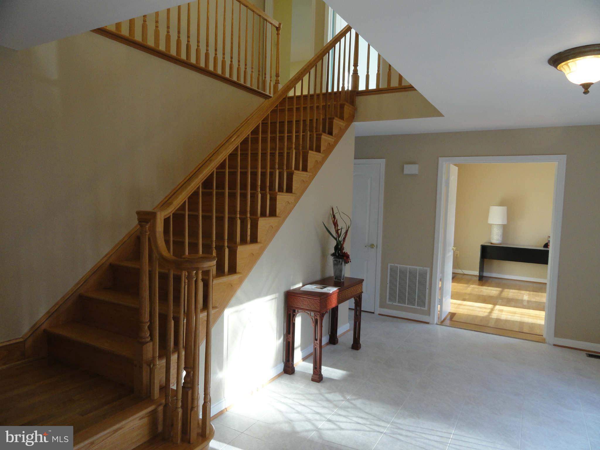 8660 Center Road, Unit 1 Springfield, VA 22152 - Photo 22 of 25 a view of entryway and hall with wooden floor