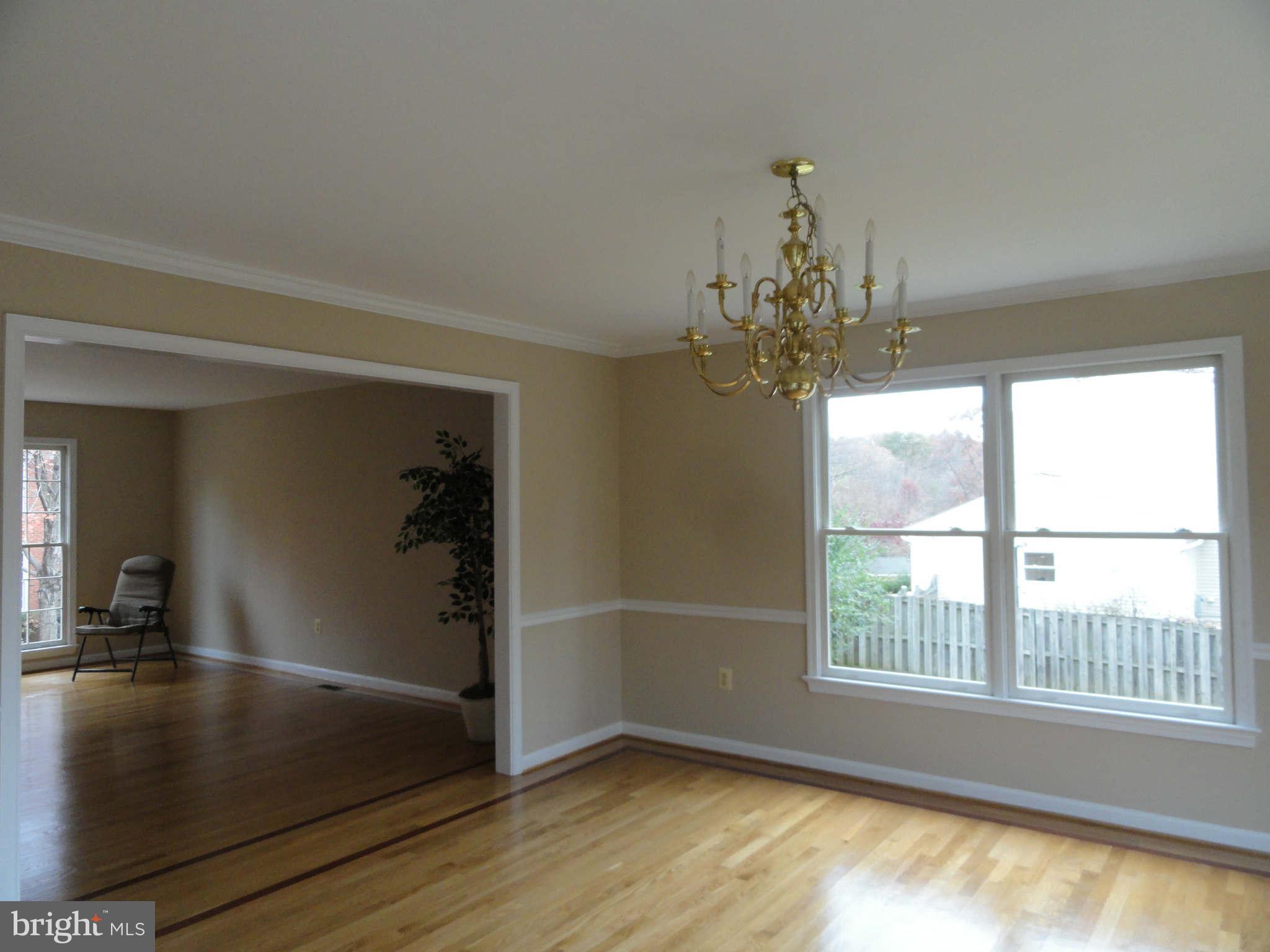 8660 Center Road, Unit 1 Springfield, VA 22152 - Photo 8 of 25 wooden floor in an empty room with a window