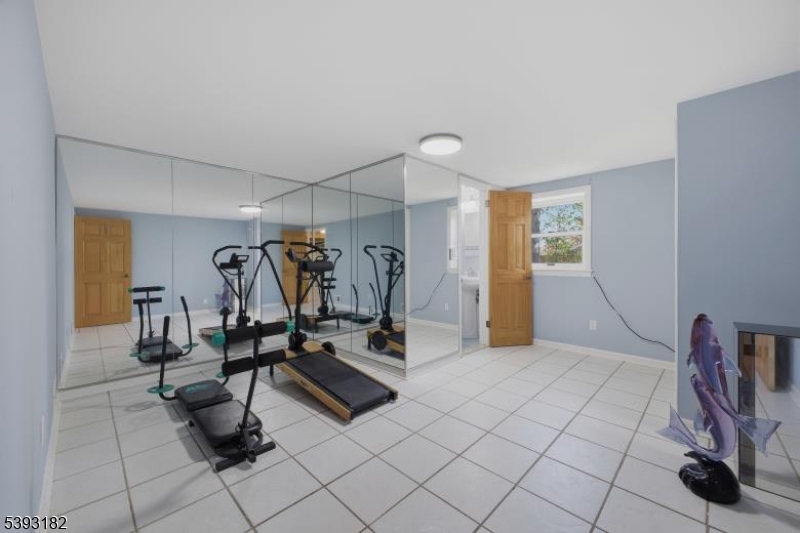 113 Barchester Way Westfield, NJ 07090 - Photo 22 of 40 a view of a room with gym equipment