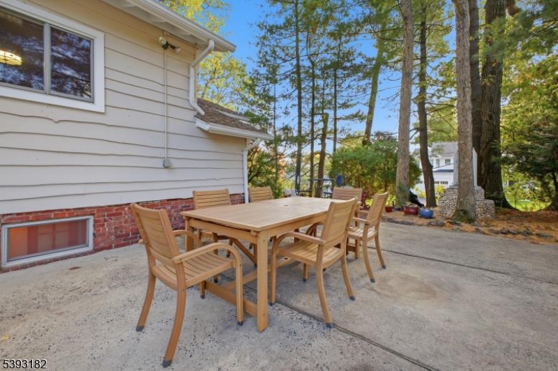 113 Barchester Way Westfield, NJ 07090 - Photo 32 of 40 a patio with table and chairs and potted plants