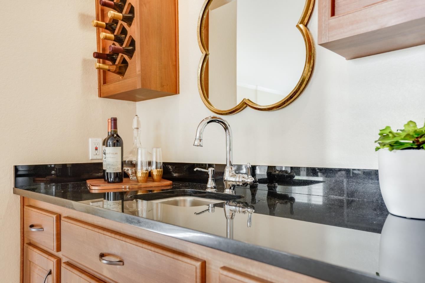 30 Bancroft Road Burlingame, CA 94010 - Photo 13 of 42 a kitchen with a sink and a mirror