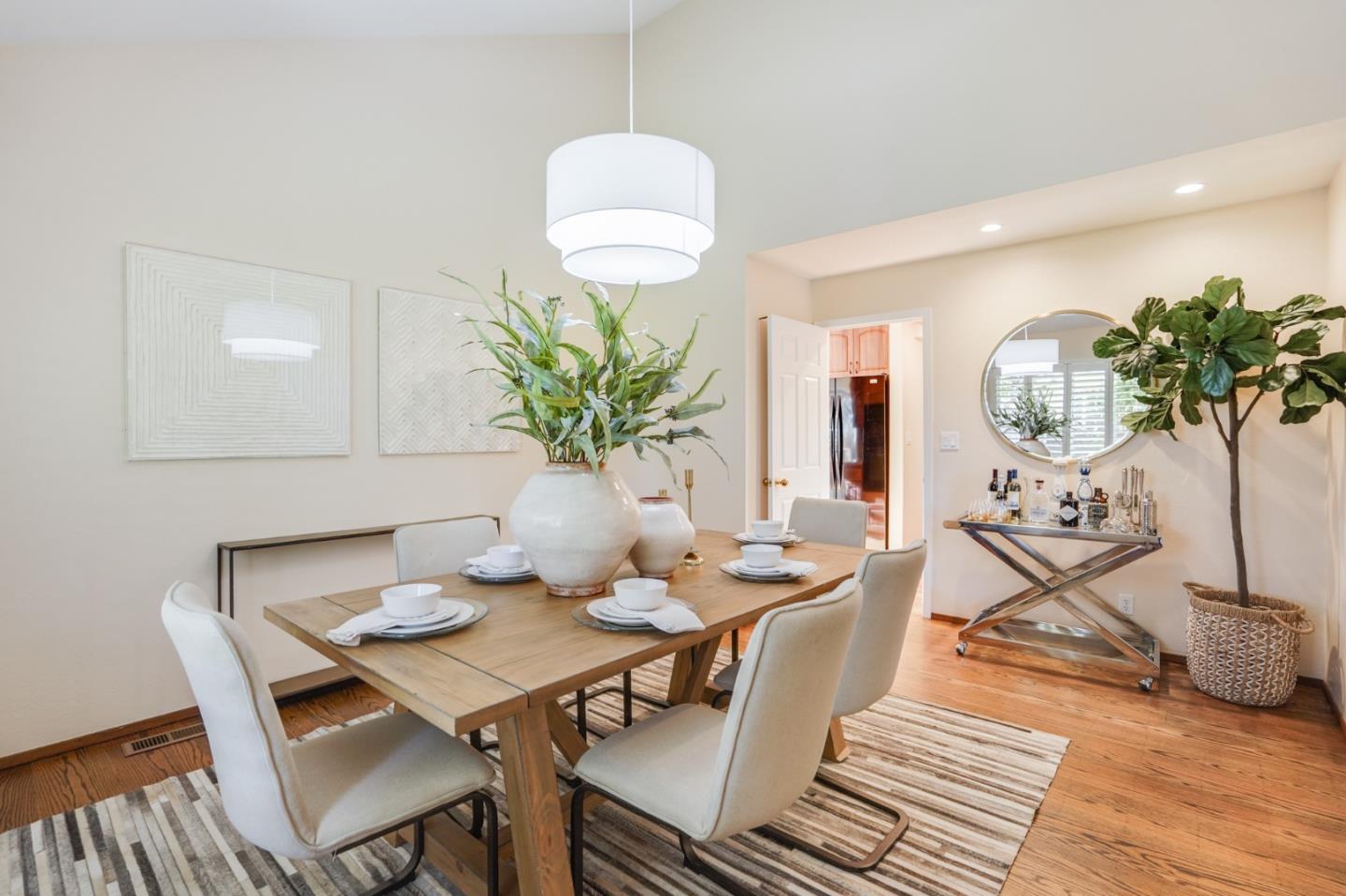 30 Bancroft Road Burlingame, CA 94010 - Photo 14 of 42 a view of a dining room with furniture and wooden floor