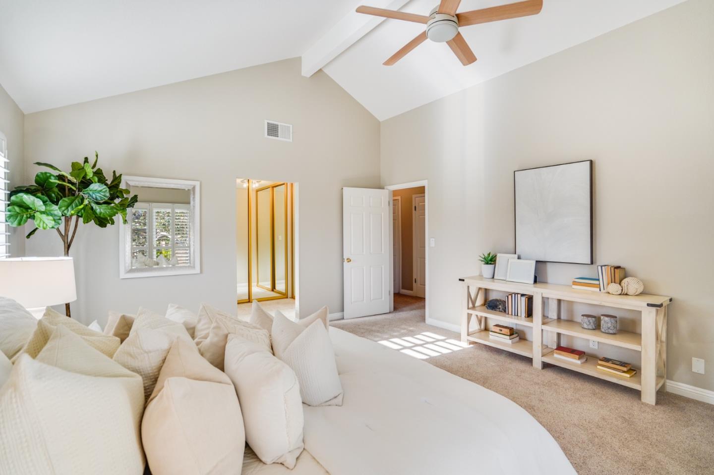 30 Bancroft Road Burlingame, CA 94010 - Photo 21 of 42 a bedroom with a bed and a chandelier