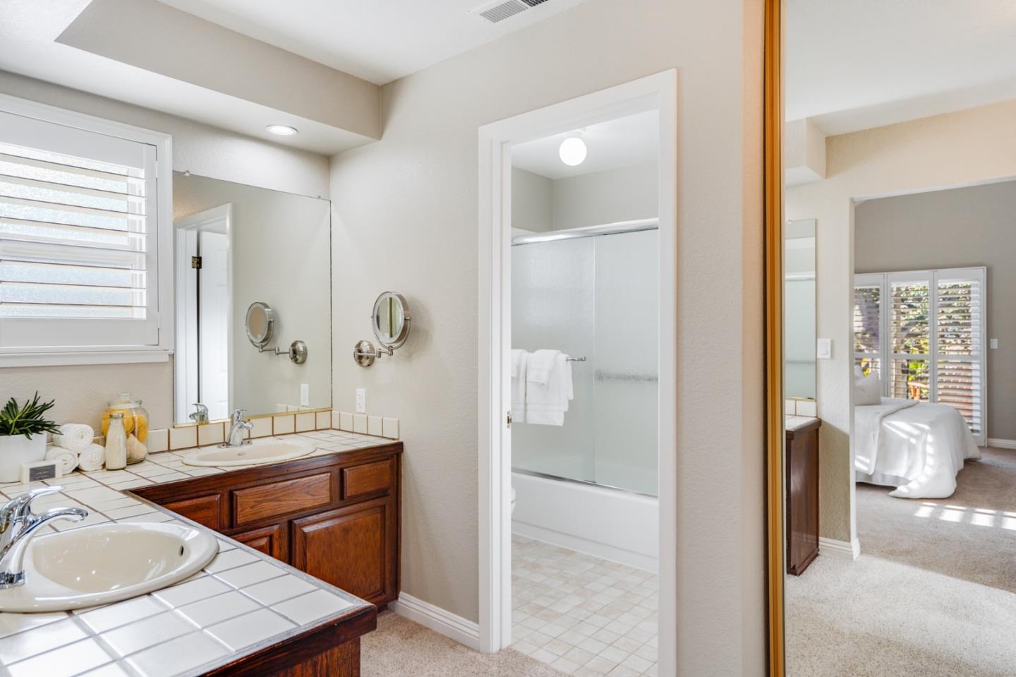 30 Bancroft Road Burlingame, CA 94010 - Photo 23 of 42 a bathroom with a tub sink and mirror