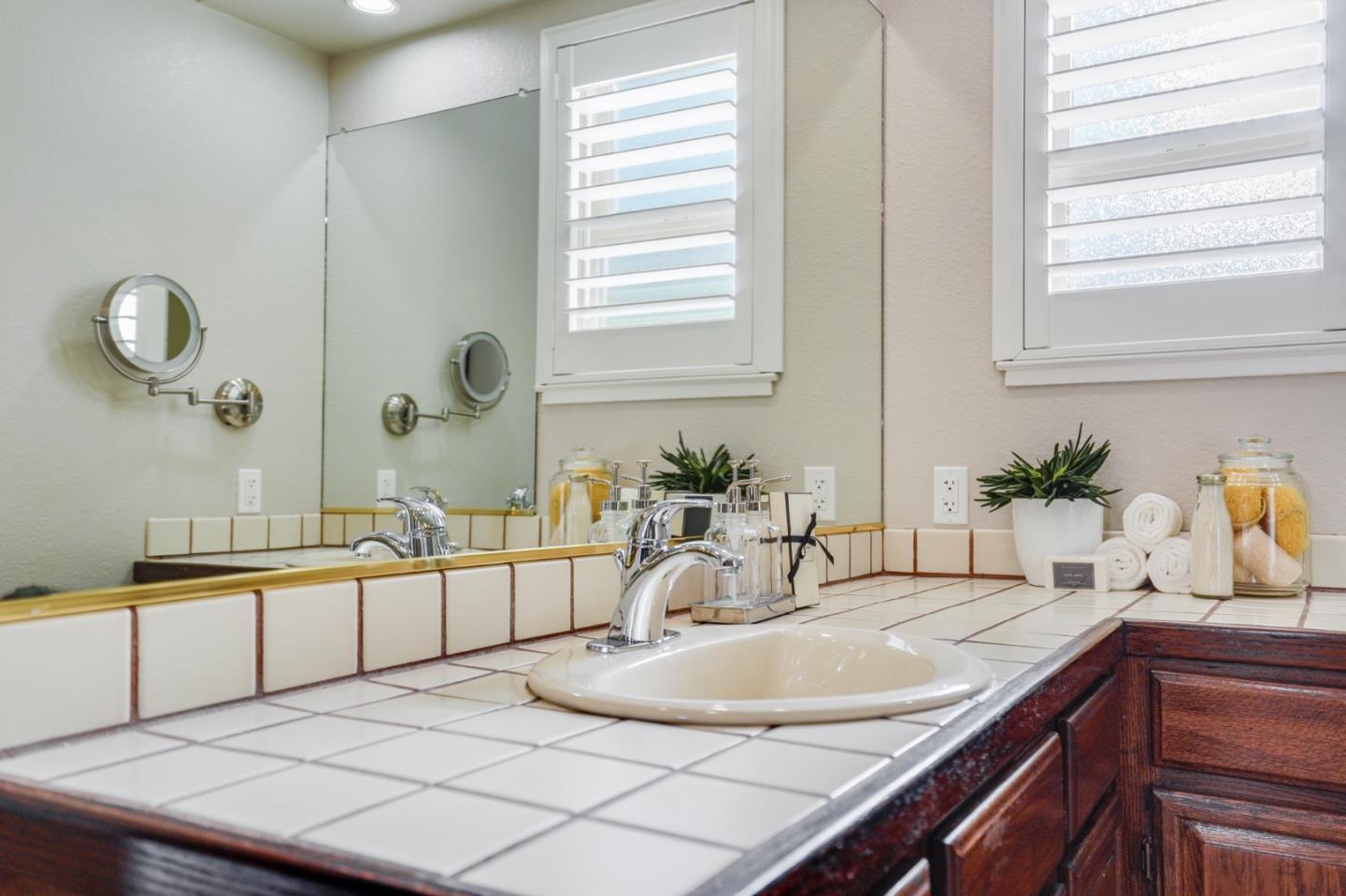 30 Bancroft Road Burlingame, CA 94010 - Photo 24 of 42 a bathroom with a sink and a mirror