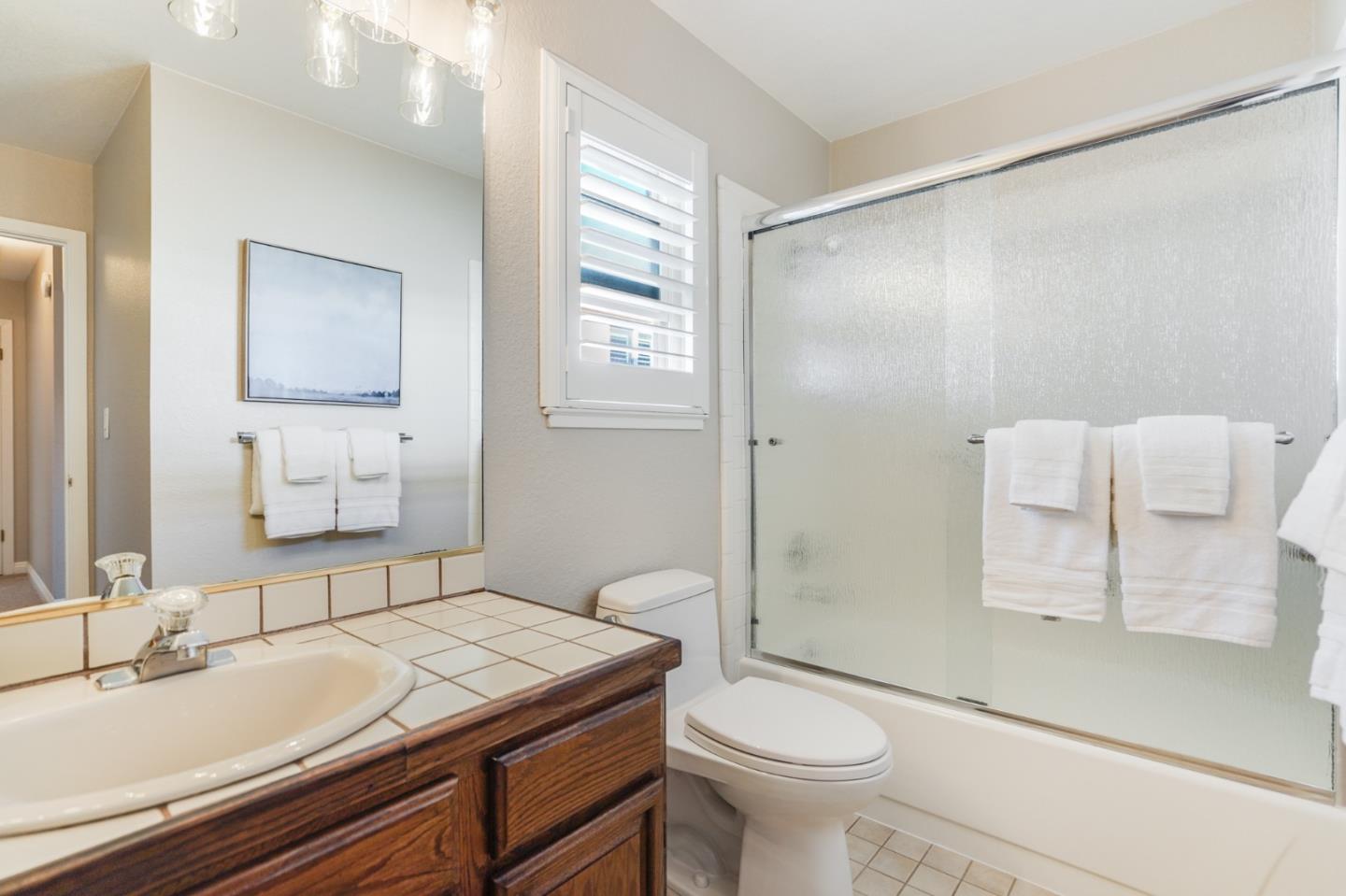 30 Bancroft Road Burlingame, CA 94010 - Photo 26 of 42 a bathroom with a granite countertop sink toilet and shower