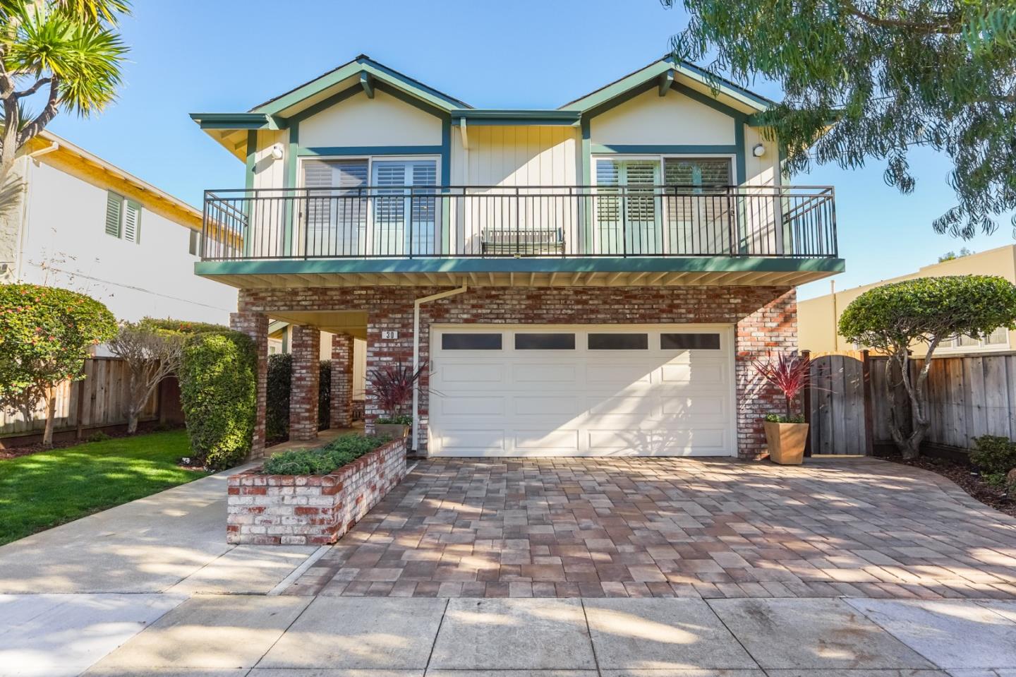30 Bancroft Road Burlingame, CA 94010 - Photo 4 of 42 a front view of a house with a yard and garage