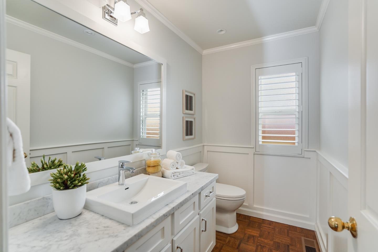 30 Bancroft Road Burlingame, CA 94010 - Photo 7 of 42 a bathroom with a toilet a sink and a mirror