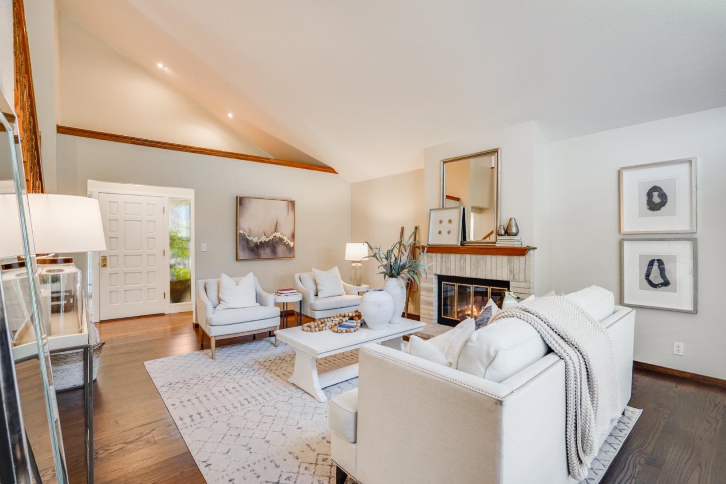 30 Bancroft Road Burlingame, CA 94010 - Photo 8 of 42 a living room with furniture a fireplace and a table