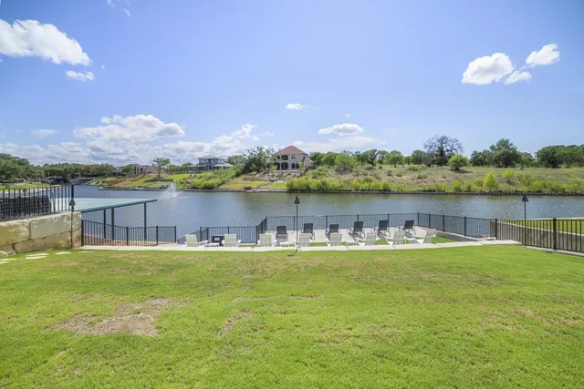 a house with swimming pool in front of it