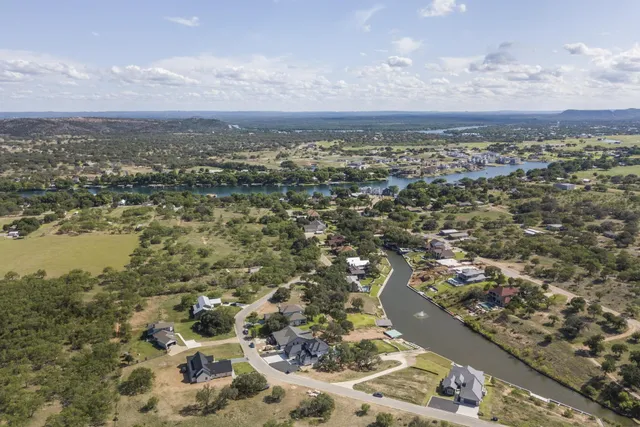 an aerial view of residential building and lake