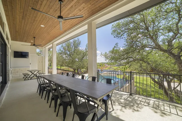 a view of a patio with a table chairs and a table