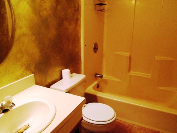 64 Tennis Plaza Road, Unit 2 Dracut, MA 01826 - Photo 12 of 20 a bathroom with a sink and a toilet
