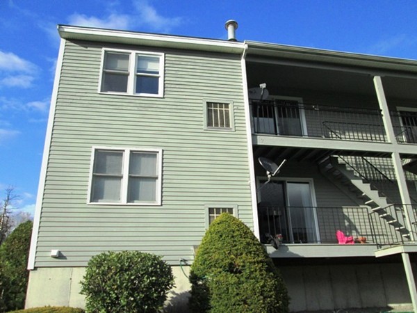 64 Tennis Plaza Road, Unit 2 Dracut, MA 01826 - Photo 16 of 20 a view of small house with a window