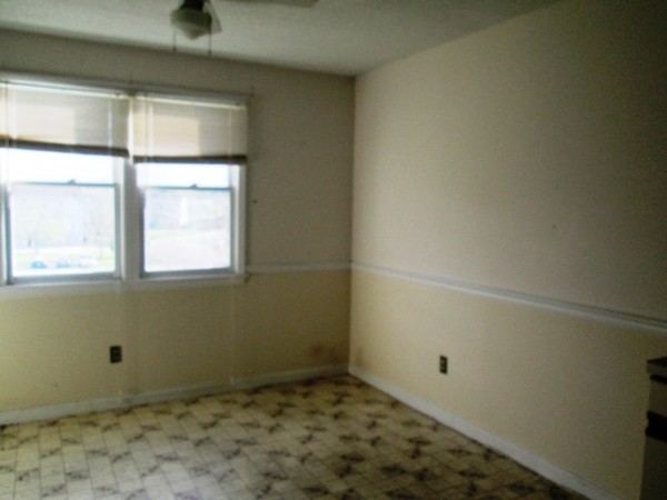 64 Tennis Plaza Road, Unit 2 Dracut, MA 01826 - Photo 10 of 20 a view of a room that has a window in it